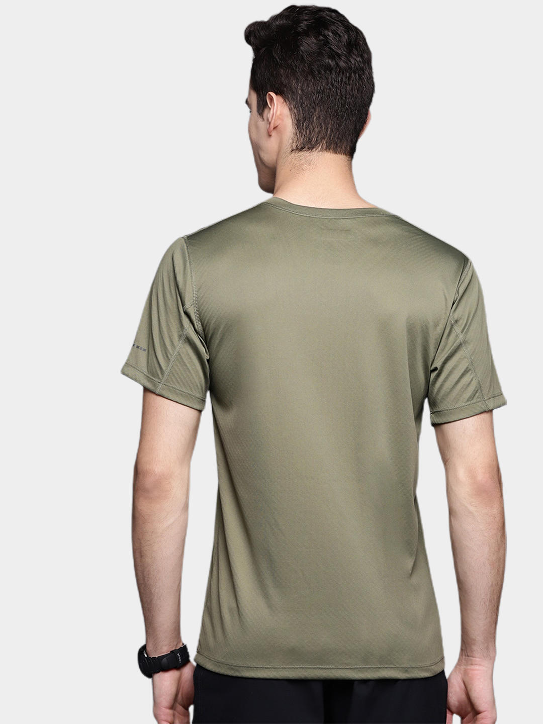 A Men Wearing Columbia Men Green Zero Rules Short Sleeve Shirt (Sun Protection)