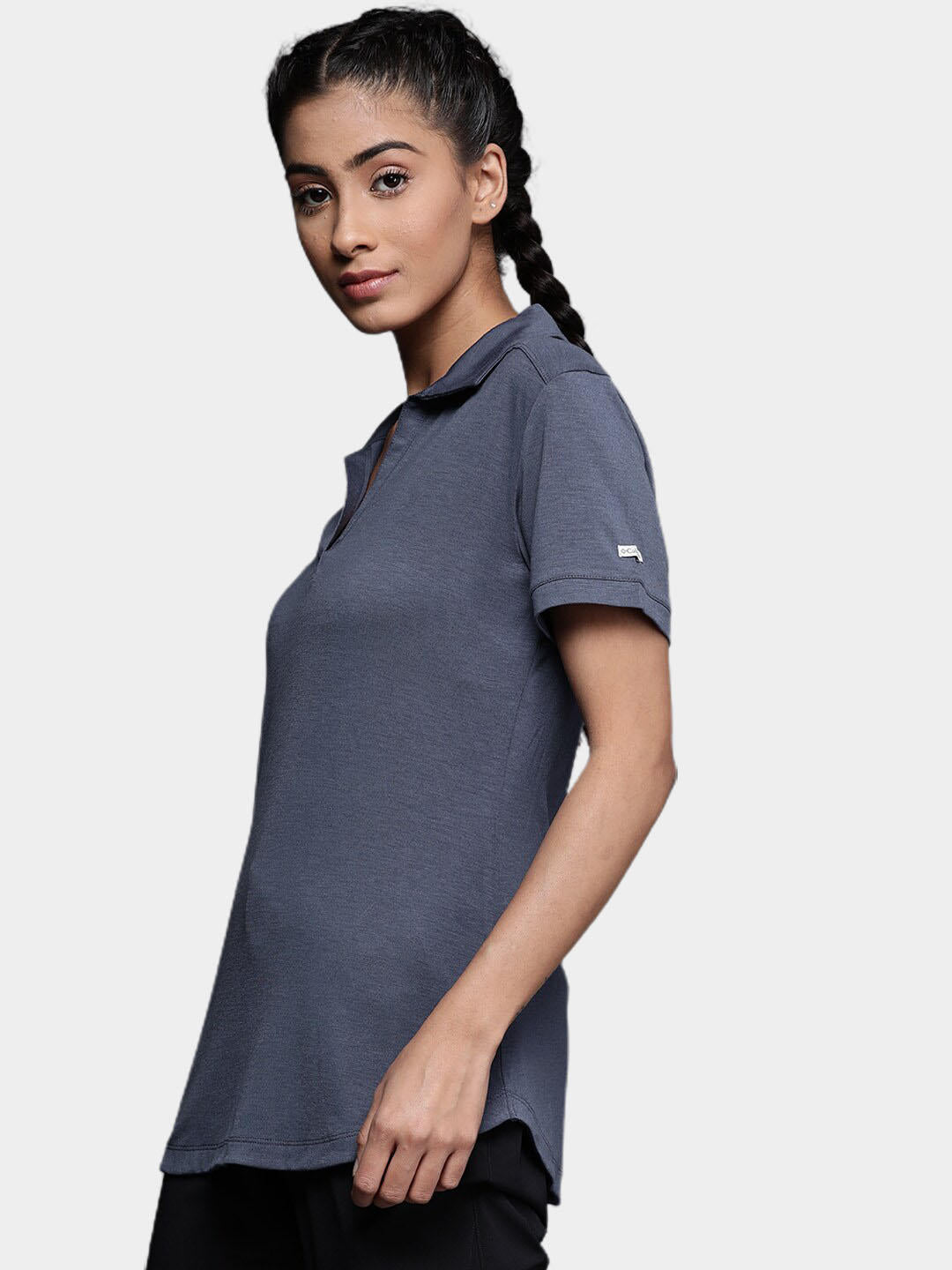 A Women Wearing Columbia Women Blue Essential Elements Polo (Sun Protection)