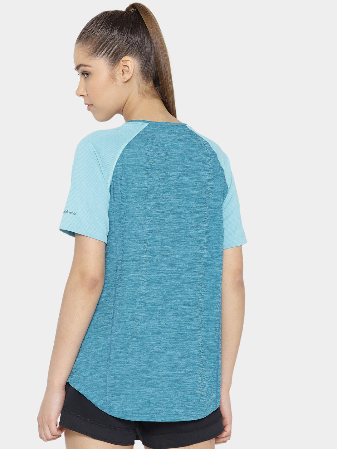 A Women Wearing Columbia Women Blue Bryce Peak Short Sleeve (Sun Protection)