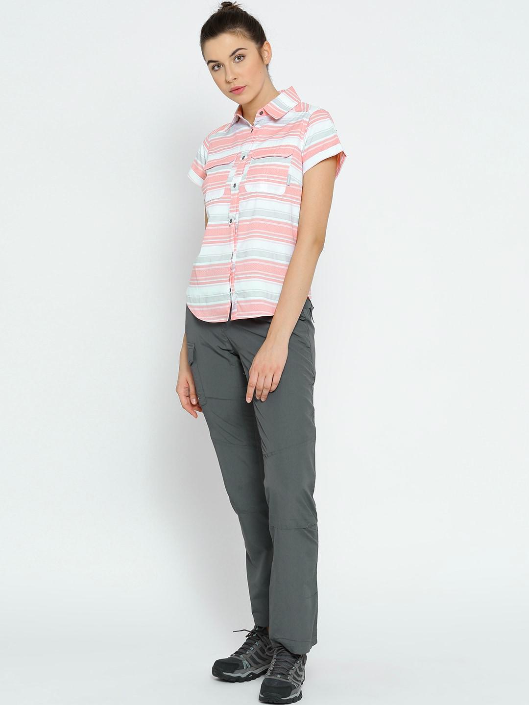 A Women Wearing Columbia Women White Pilsner Peak Novelty Short Sleeve Shirt (Sun Protection)