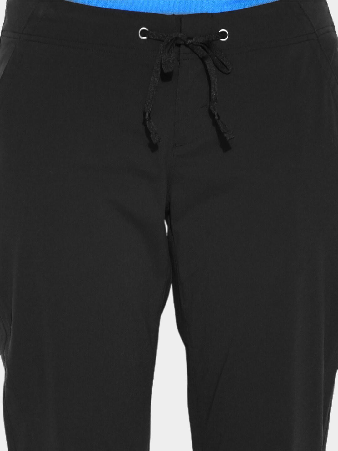 A Women Wearing Columbia Women Black Anytime Outdoor Boot Cut Pant (Sun Protection)