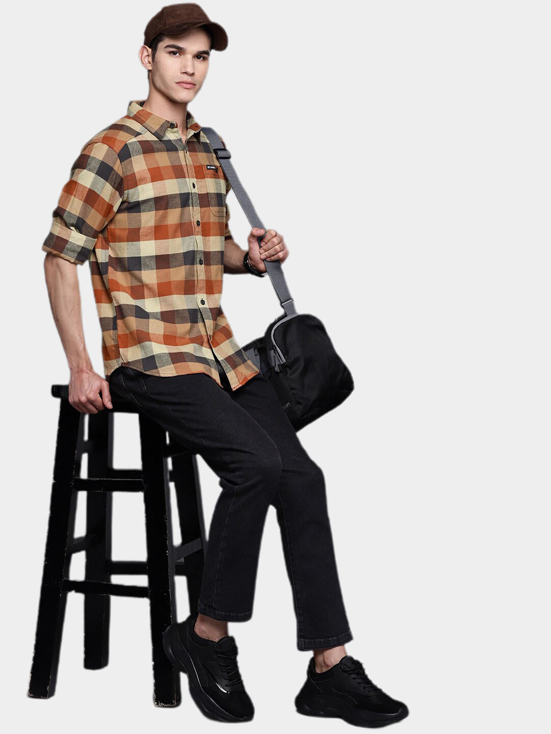 A Men Wearing Columbia Men Brown Cornell Woods Flannel Long Sleeve Shirt