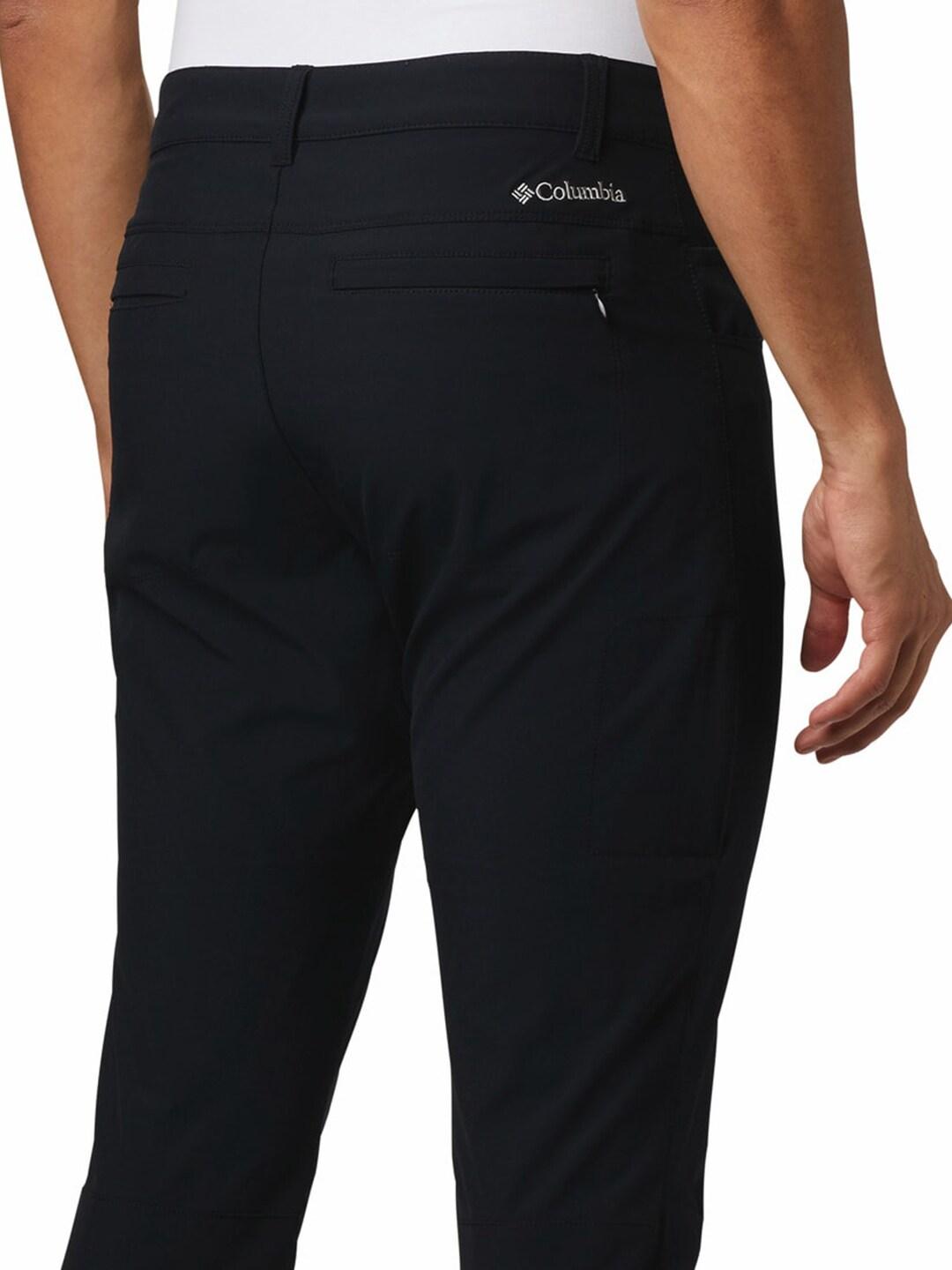 A Men Wearing Columbia Men Black Outdoor Elements Stretch Pant (Sun Protection)