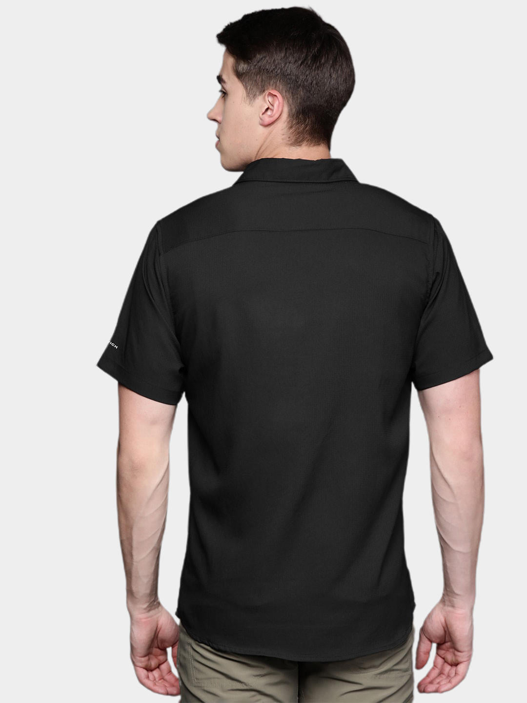 A Men Wearing Columbia Men Black Utilizer II Solid Short Sleeve Shirt (Sun Protection)