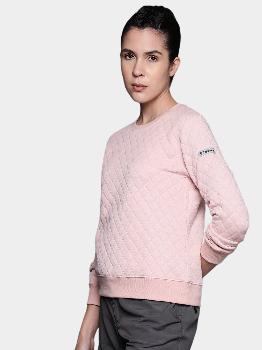 A Women Wearing Columbia Women Pink Columbia Lodge Quilted Crew
