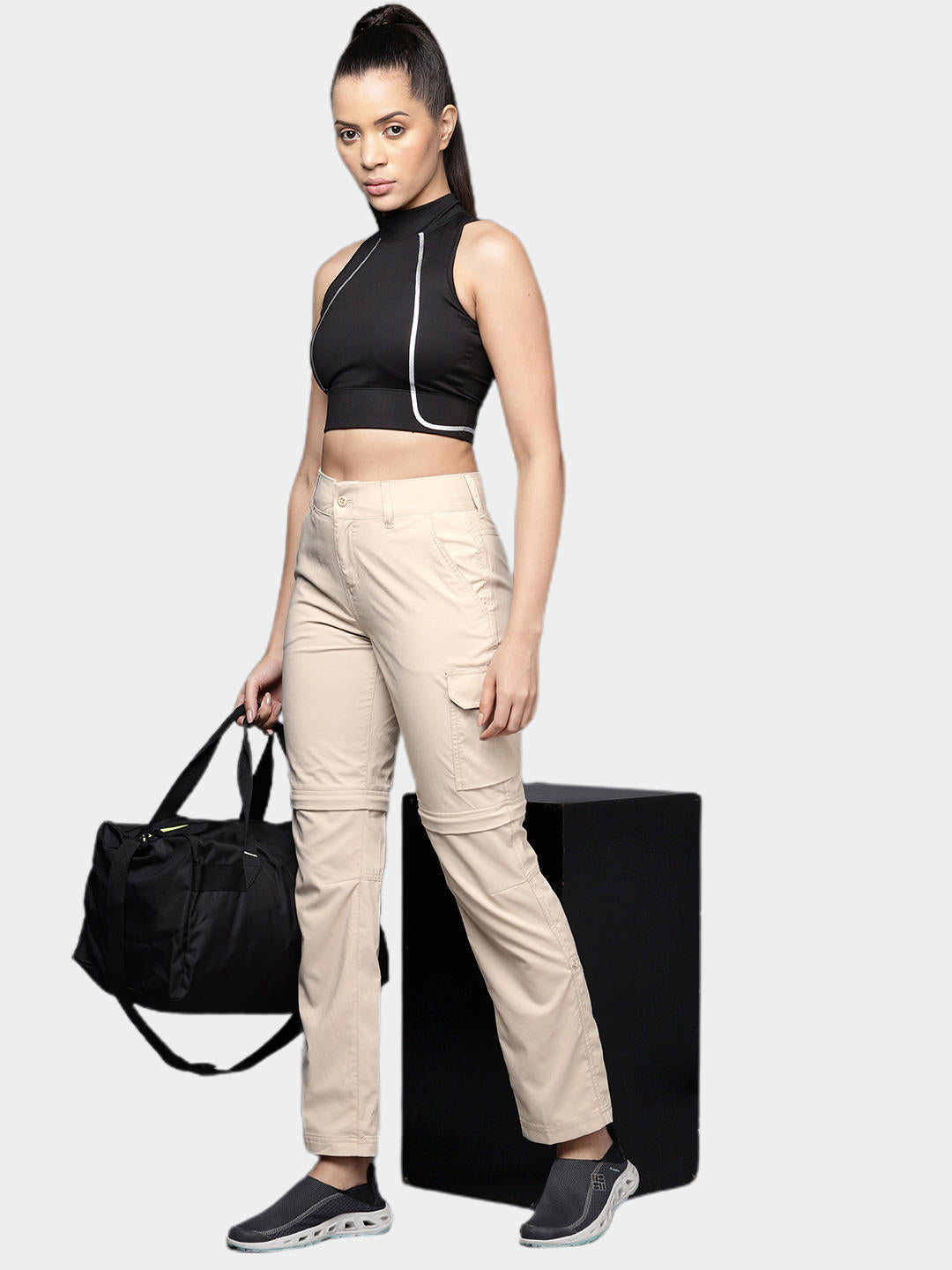 A Women Wearing Columbia Women Brown Silver Ridge Utility Convertible Pant (Sun Protection)