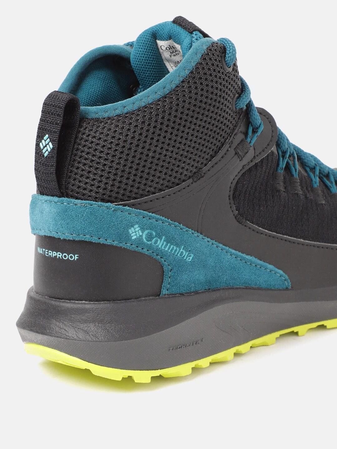 A Women Wearing Columbia Women Black TRAILSTORM MID WATERPROOF