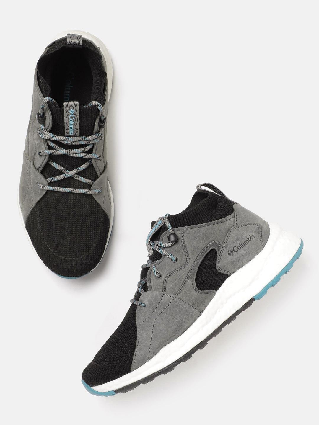 A Women Wearing Columbia Women Black SH/FT OUTDRY MID