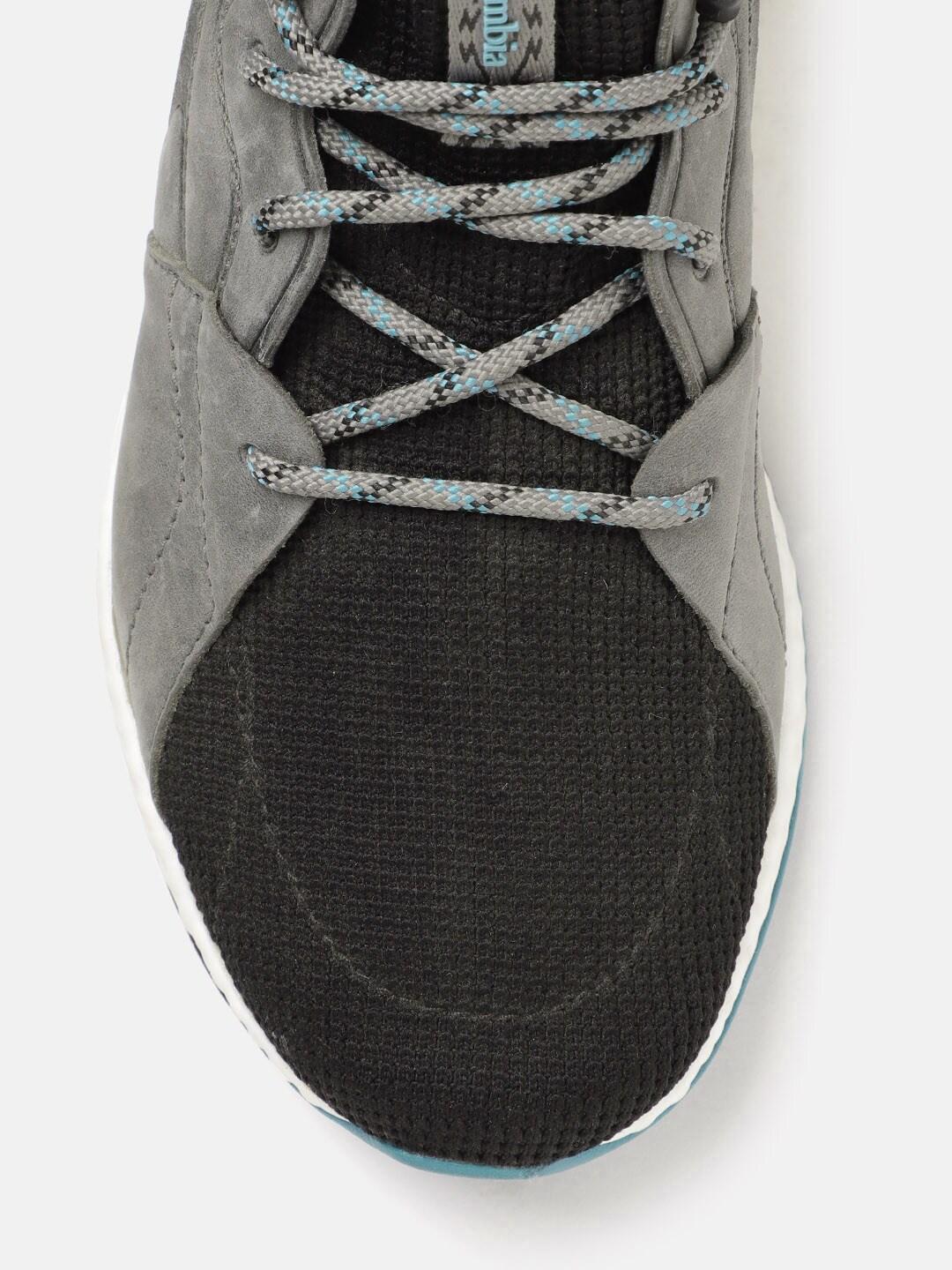 A Women Wearing Columbia Women Black SH/FT OUTDRY MID