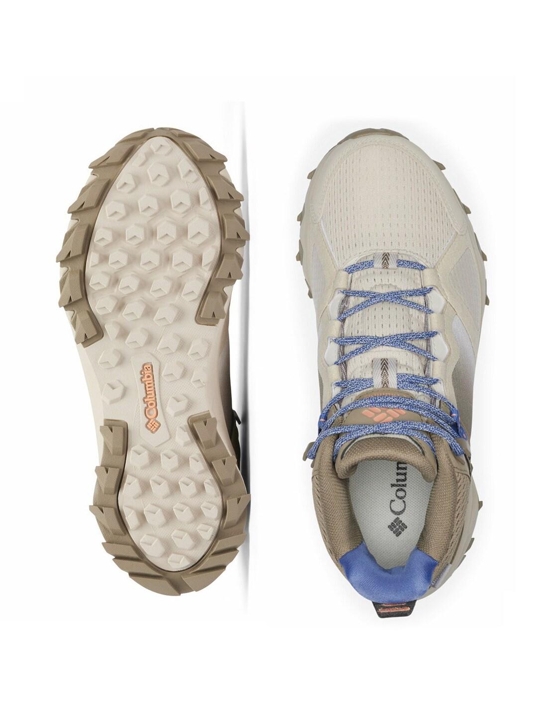A Women Wearing Columbia Women Brown PEAKFREAK HERA MID OUTDRY