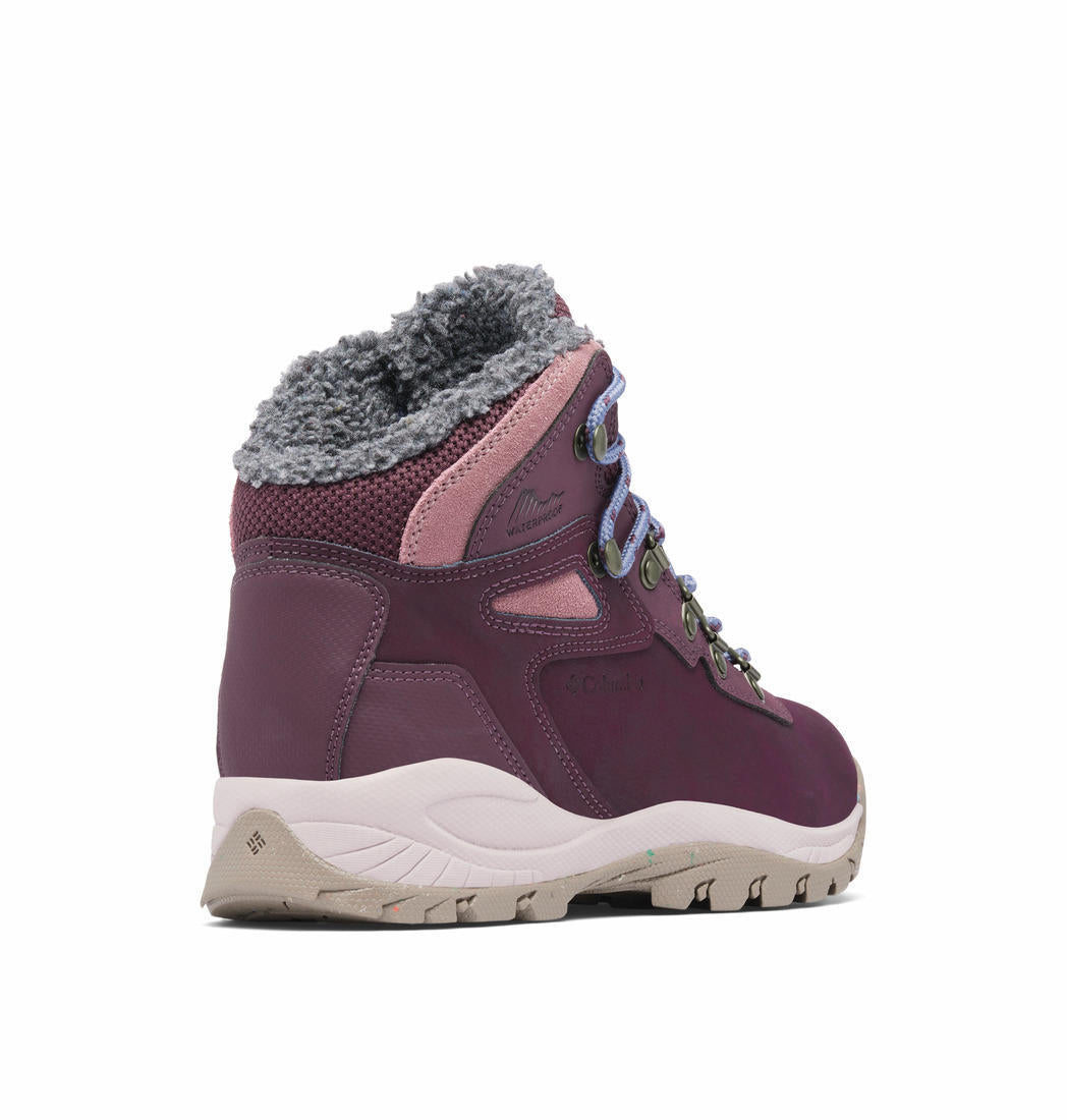 A Women Wearing Columbia Women Red NEWTON RIDGE WP OMNI-HEAT II