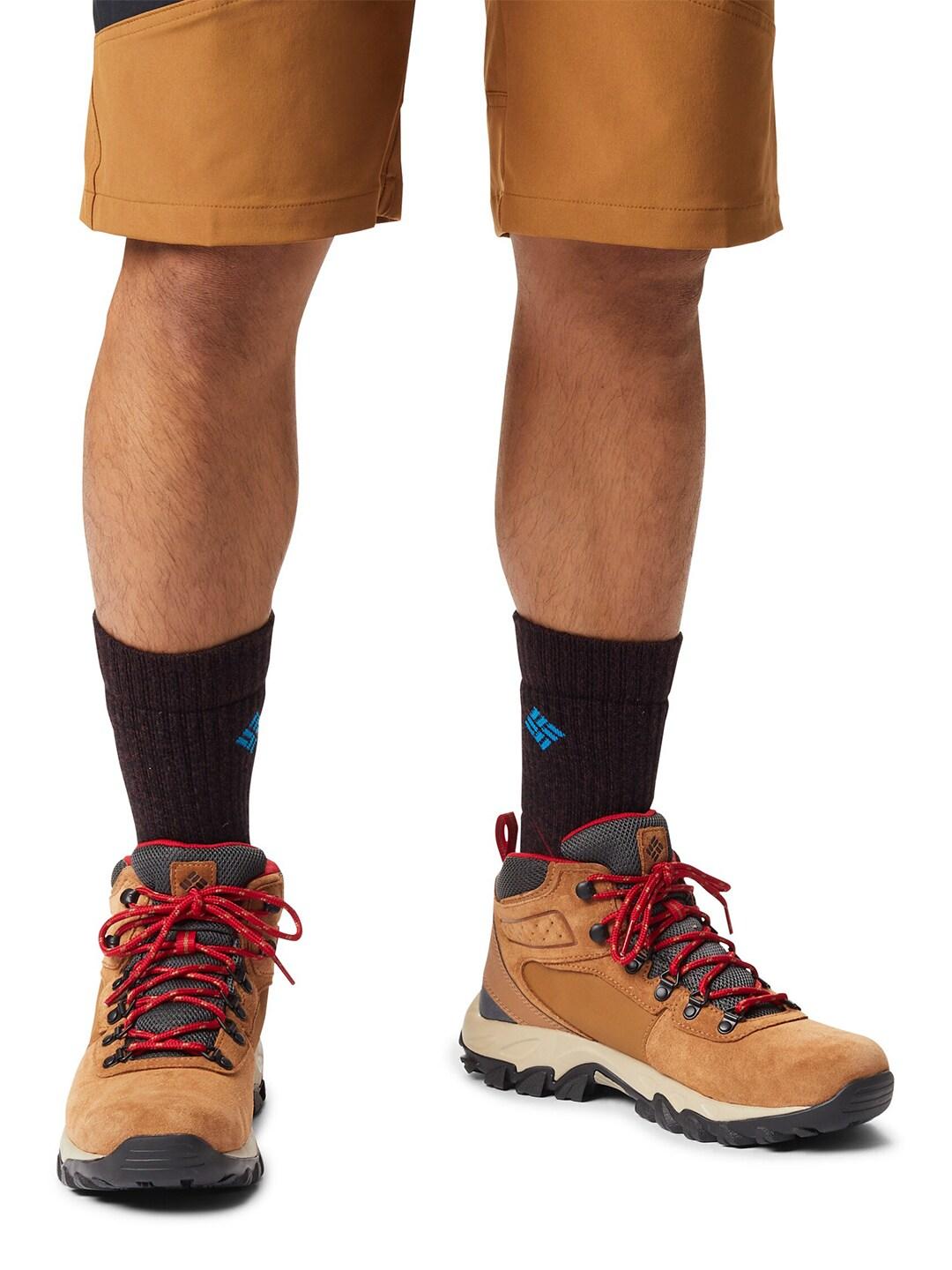 A Men Wearing Columbia Men Brown NEWTON RIDGE PLUS II SUEDE WP