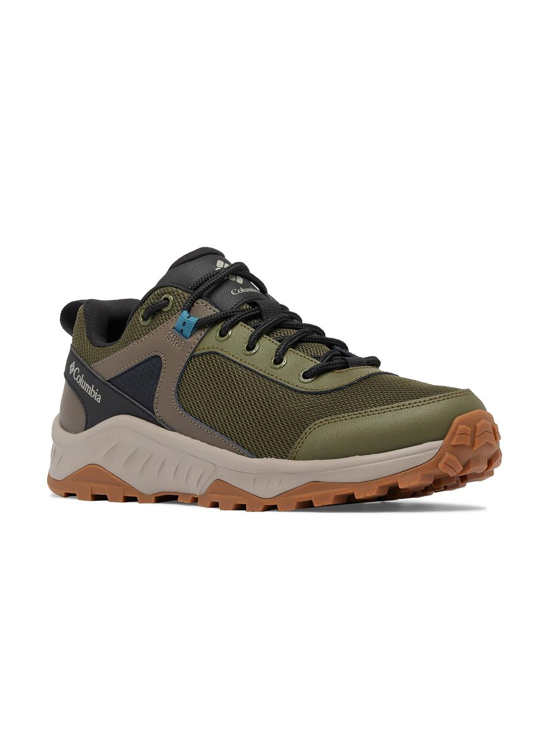 A pair of Columbia men's green hiking shoes with black and brown accents.