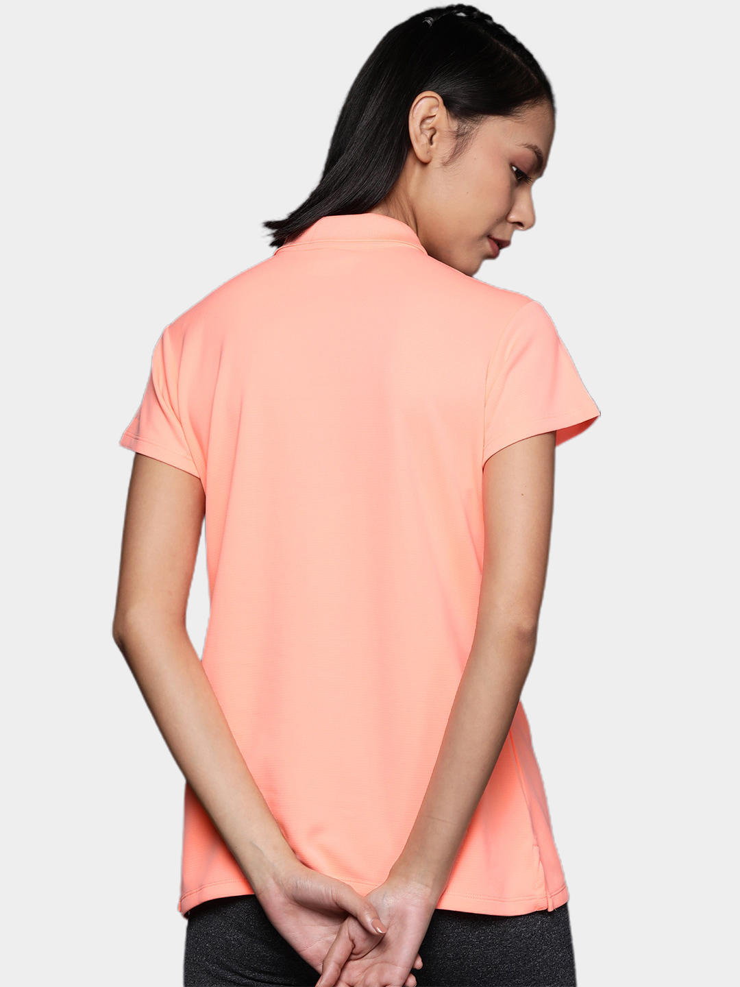 A Women Wearing Columbia Women Peach Innisfree SS Polo (Sun Protection)
