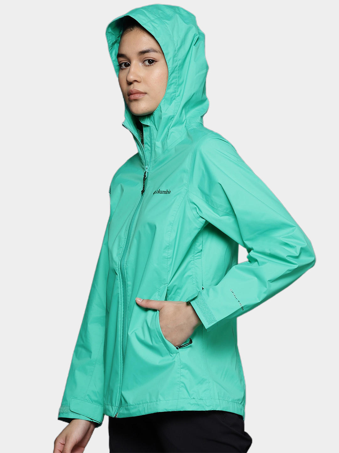 A Women Wearing Columbia Women Green EvaPOURation Jacket Waterproof