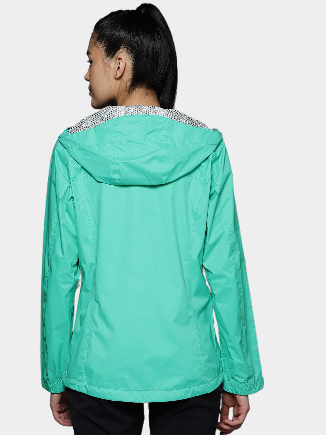 A Women Wearing Columbia Women Green EvaPOURation Jacket Waterproof