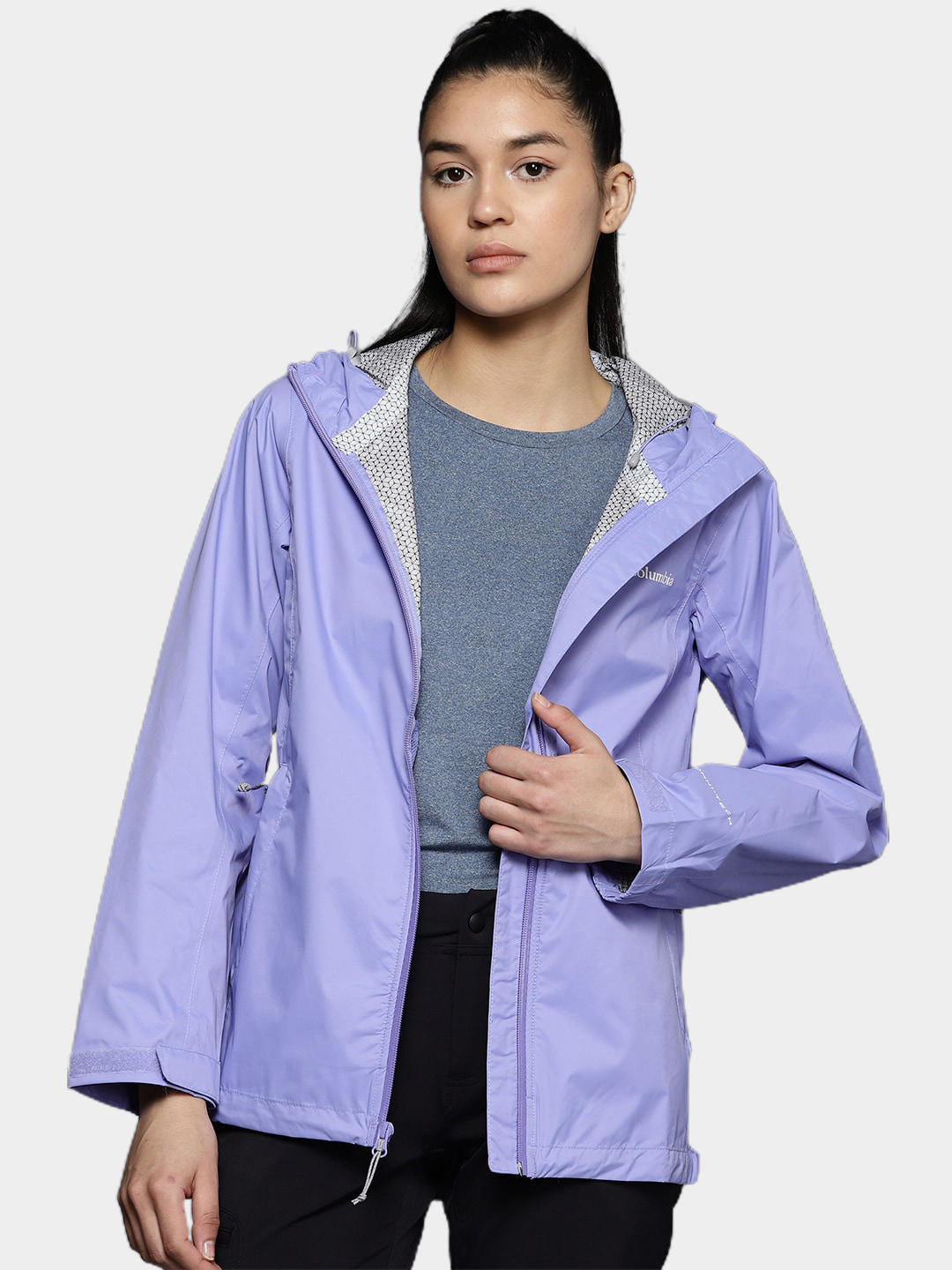 A Women Wearing Columbia Women Purple EvaPOURation Jacket Waterproof