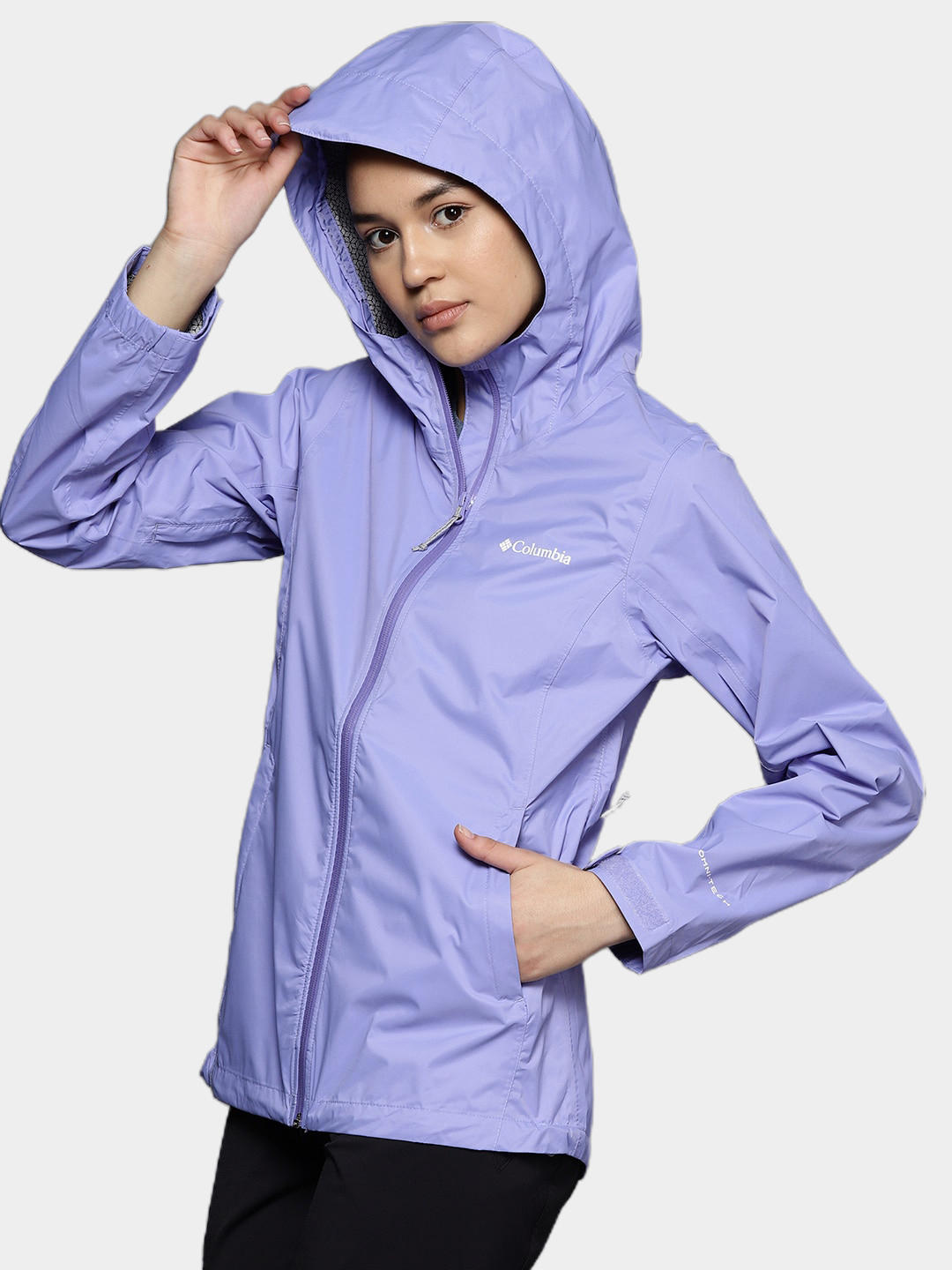 A Women Wearing Columbia Women Purple EvaPOURation Jacket Waterproof
