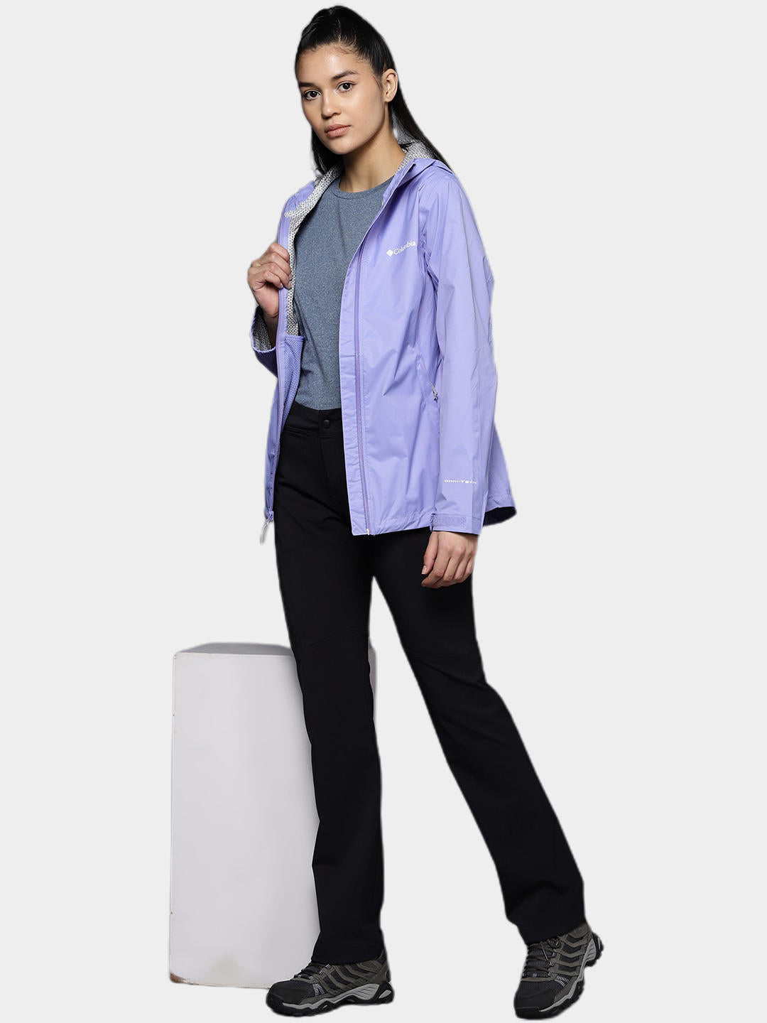 A Women Wearing Columbia Women Purple EvaPOURation Jacket Waterproof