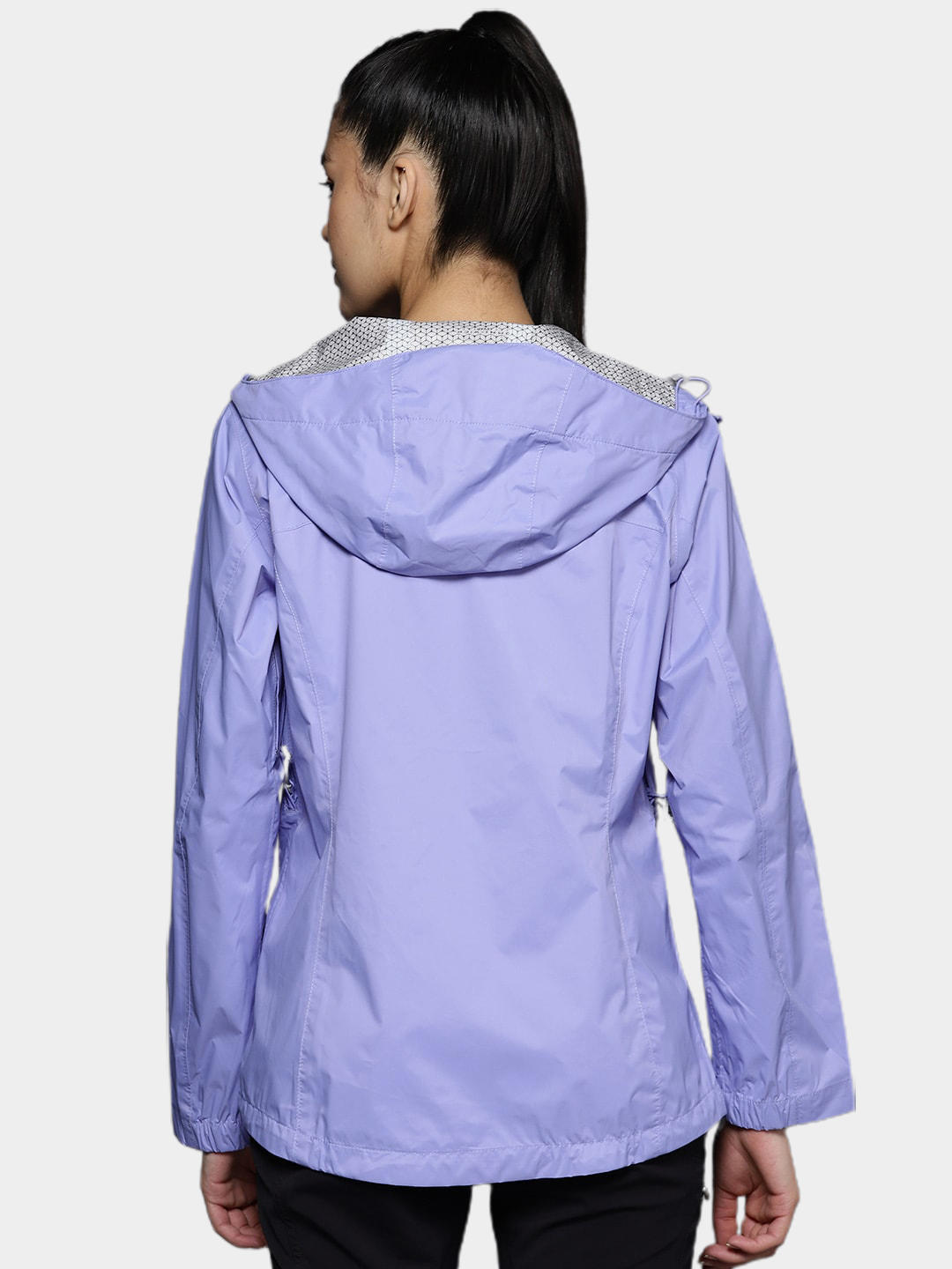 A Women Wearing Columbia Women Purple EvaPOURation Jacket Waterproof
