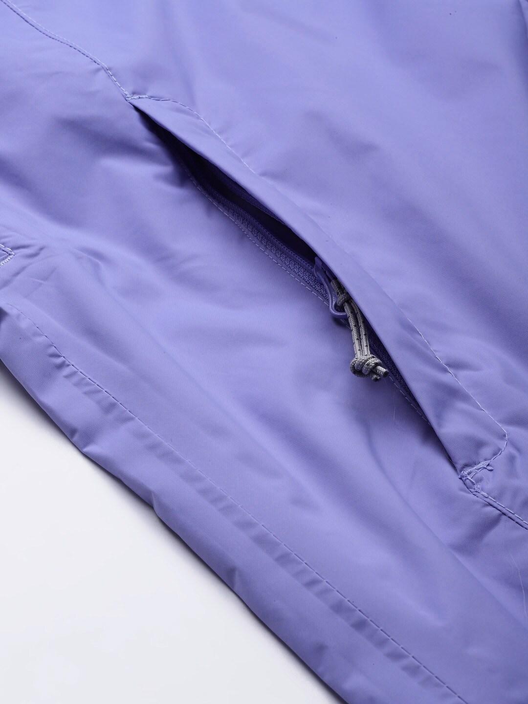 A Women Wearing Columbia Women Purple EvaPOURation Jacket Waterproof