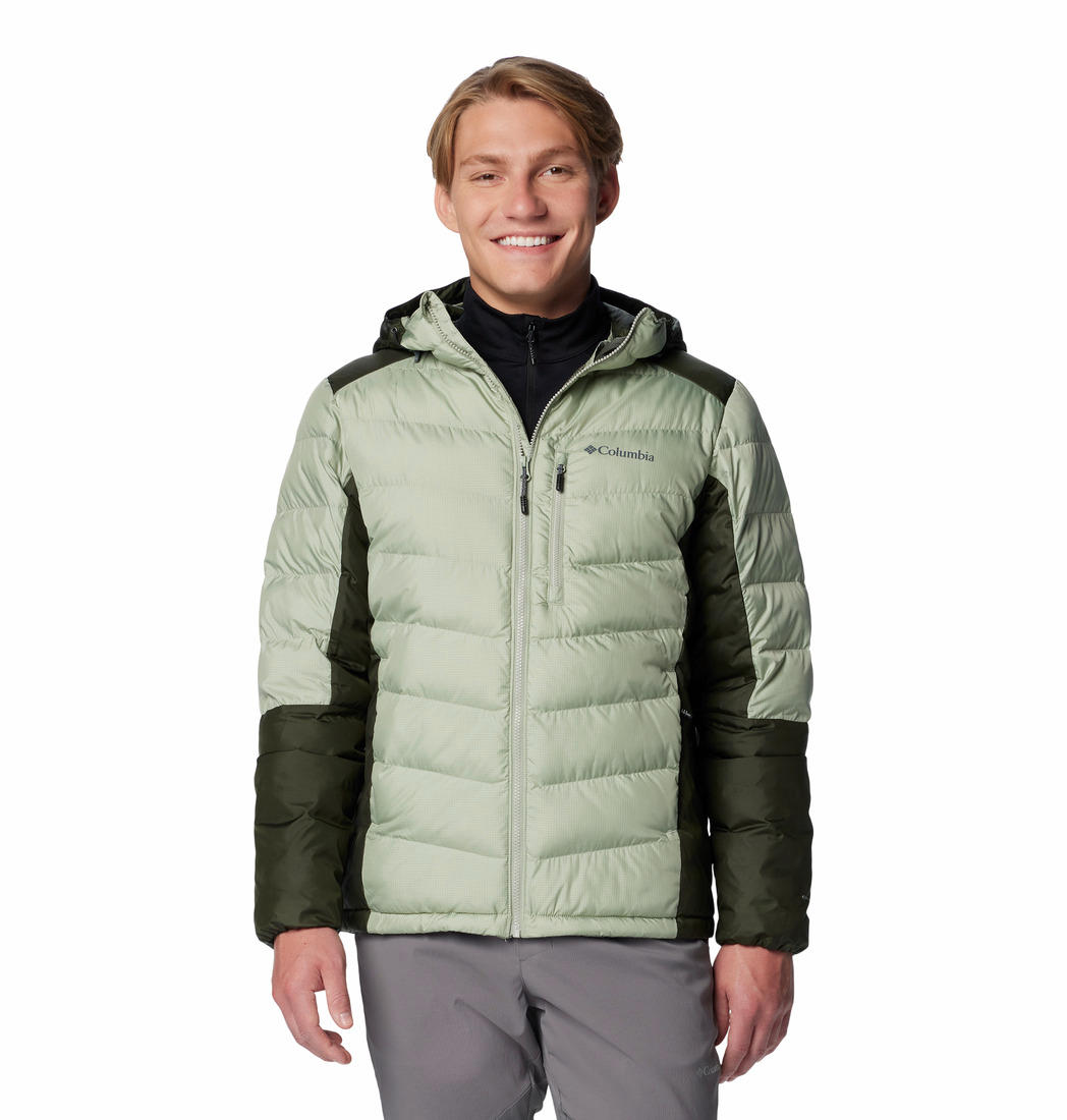 A man wearing a green and gray Columbia hooded jacket with a zipper and long sleeves.