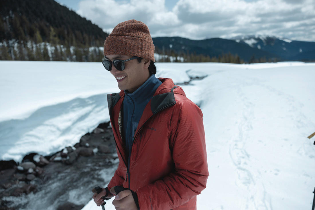 A Men Wearing Columbia Men Orange Arch Rock Double Wall Elite Hooded Jacket