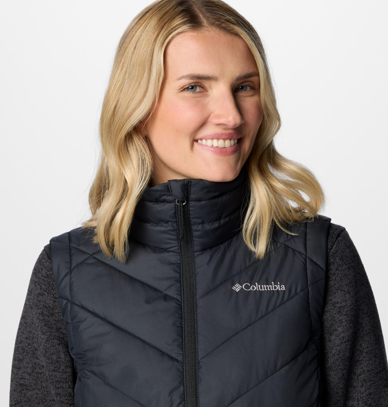 A Women Wearing Columbia Women Black Heavenly II Vest