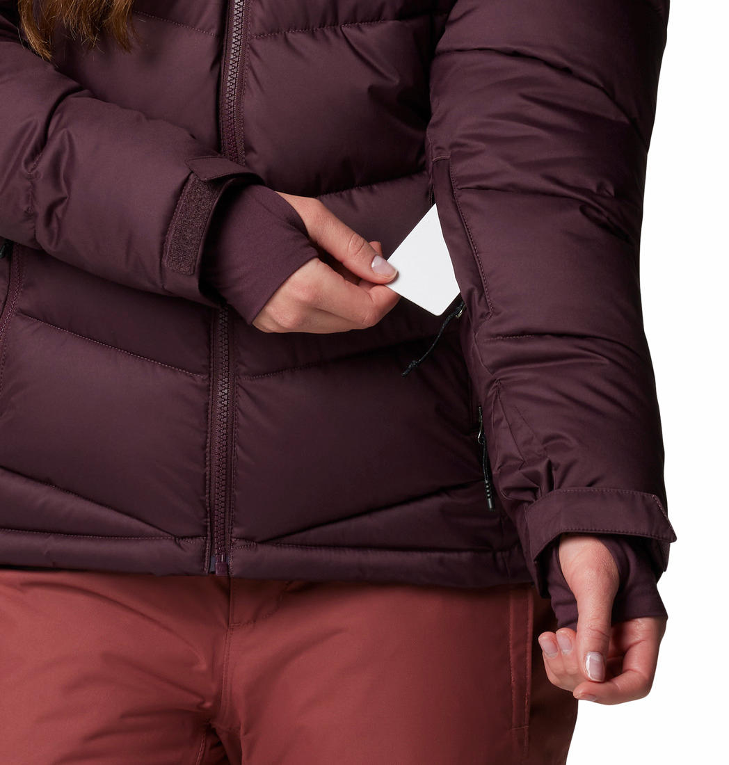 A Women Wearing Columbia Women Red Abbott Peak II Insulated Jacket
