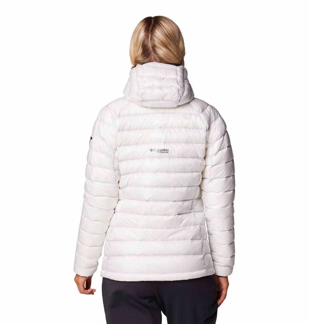 A Women Wearing Columbia Women White Arctic Crest Down Hooded Jacket