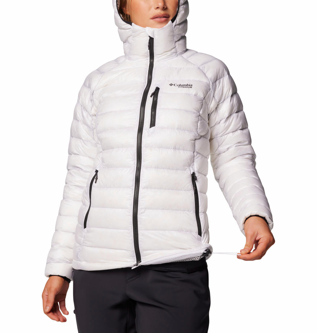 A Women Wearing Columbia Women White Arctic Crest Down Hooded Jacket