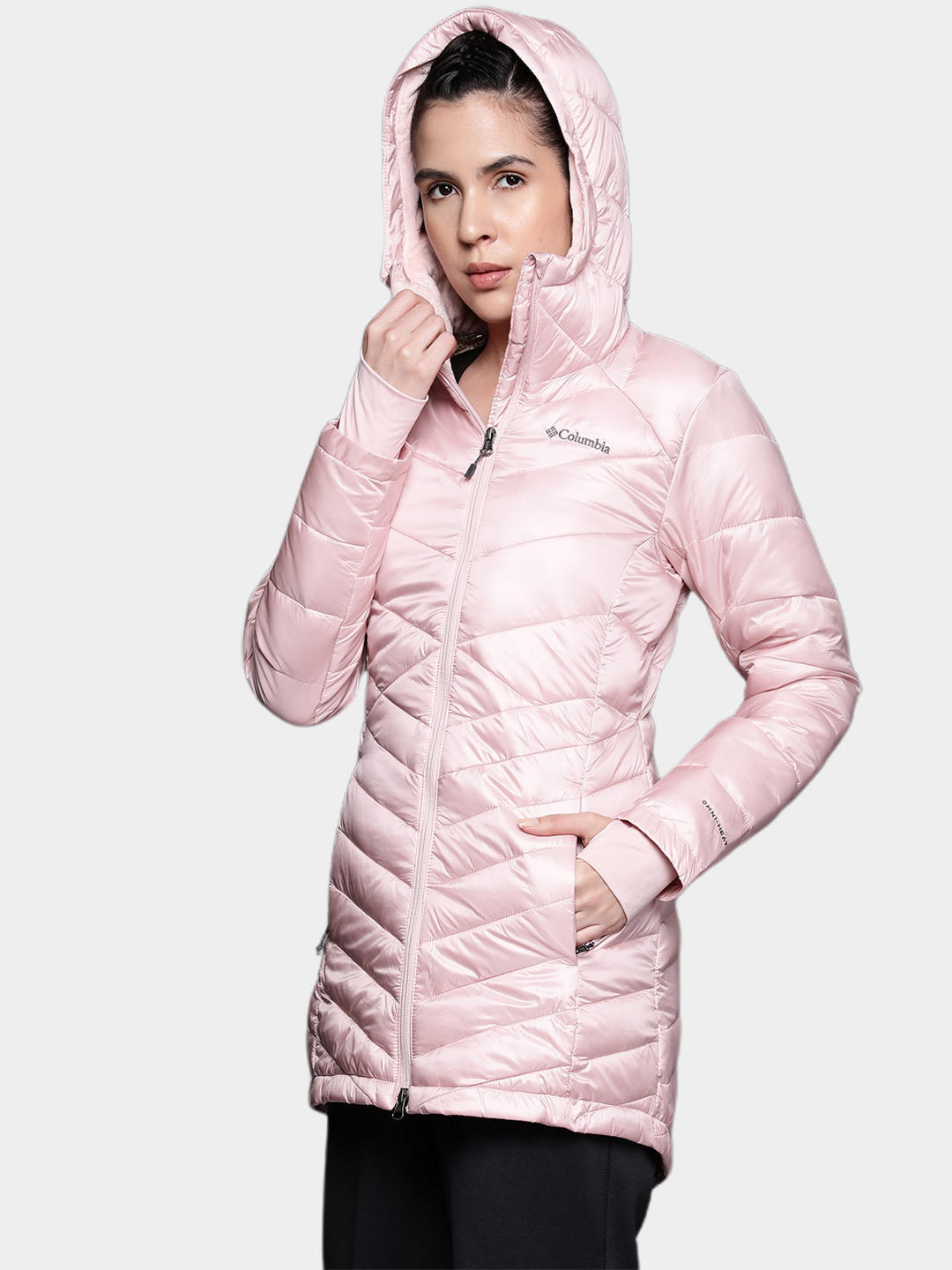 A Women Wearing Columbia Women Pink Joy Peak Mid Jacket