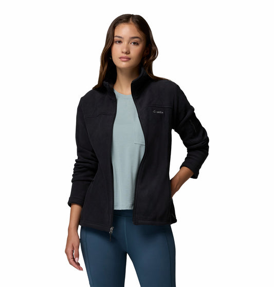 Woman wearing a black jacket with Columbia logo on a white background