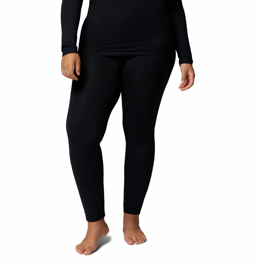 Person wearing black leggings on a white background