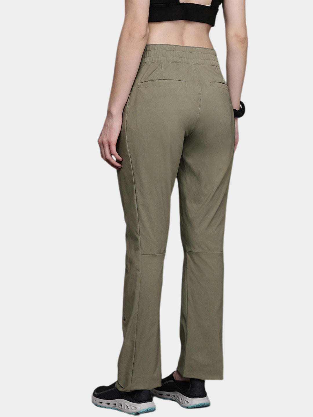 A Women Wearing Columbia Women Green Firwood Core Pant (Sun Protection)