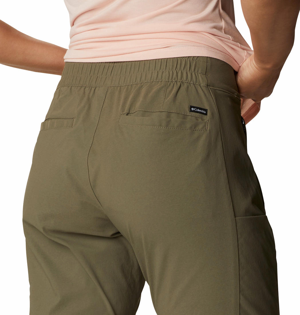 A Women Wearing Columbia Women Green Firwood Core Pant (Sun Protection)