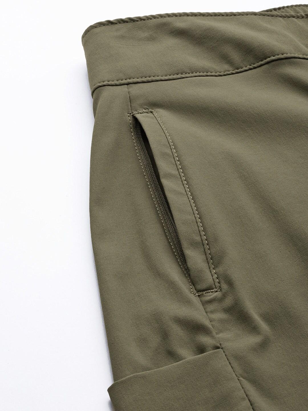 A Women Wearing Columbia Women Green Firwood Core Pant (Sun Protection)