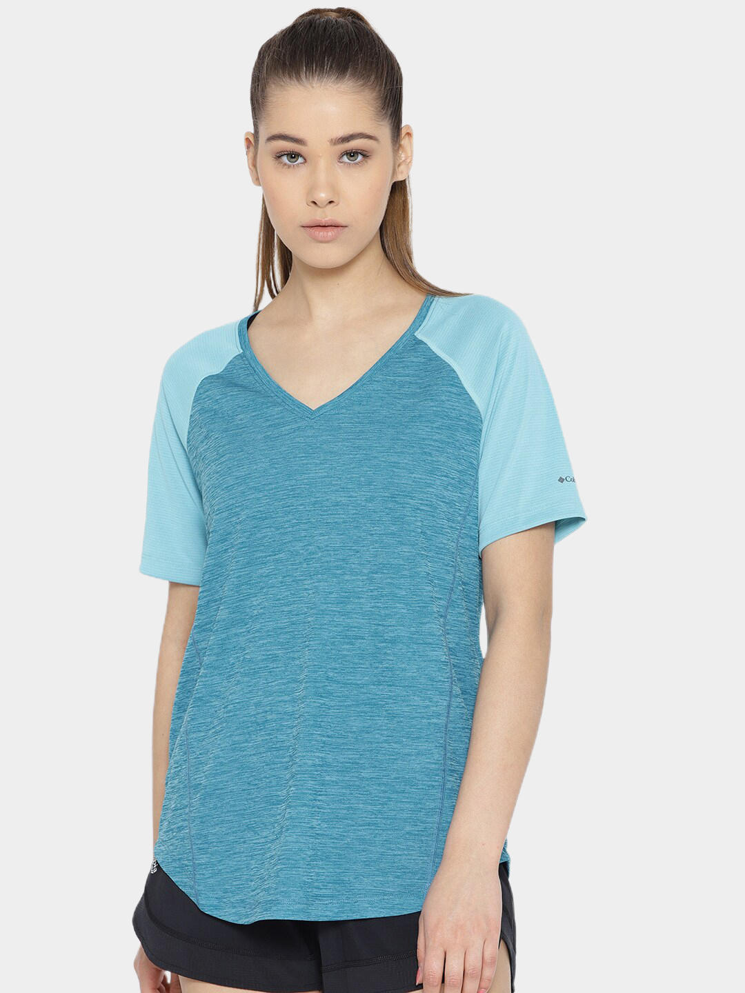 A Women Wearing Columbia Women Blue Bryce Peak Short Sleeve (Sun Protection)