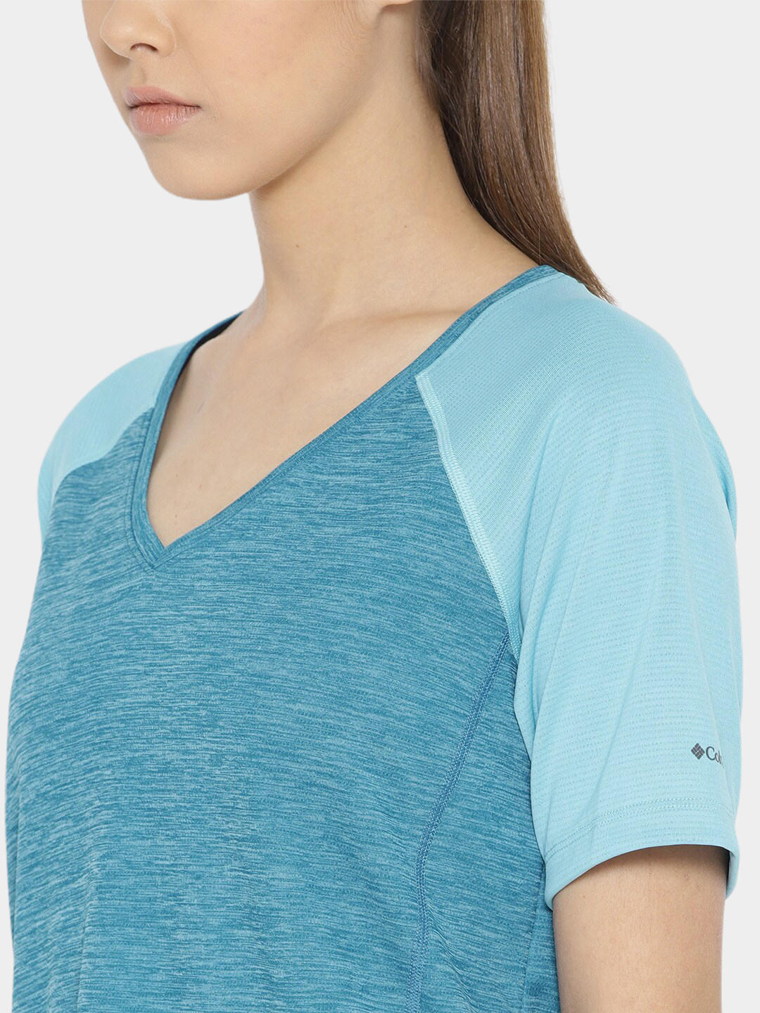 A Women Wearing Columbia Women Blue Bryce Peak Short Sleeve (Sun Protection)