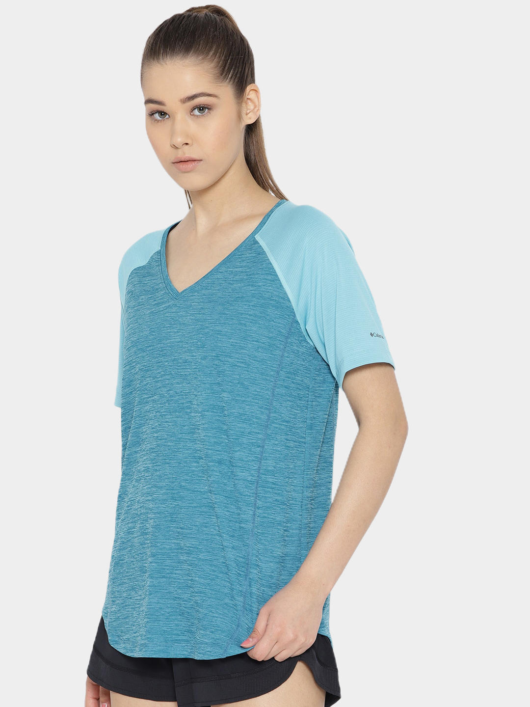 A Women Wearing Columbia Women Blue Bryce Peak Short Sleeve (Sun Protection)