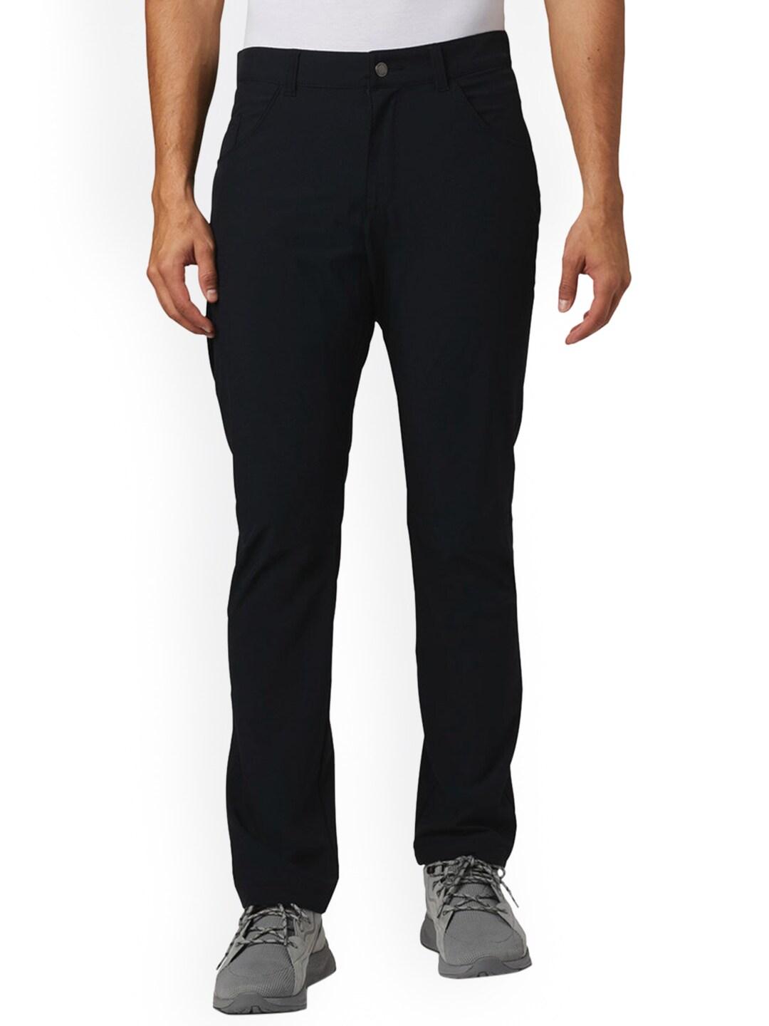 A Men Wearing Columbia Men Black Outdoor Elements Stretch Pant (Sun Protection)