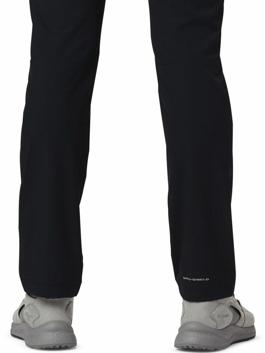 A Men Wearing Columbia Men Black Outdoor Elements Stretch Pant (Sun Protection)