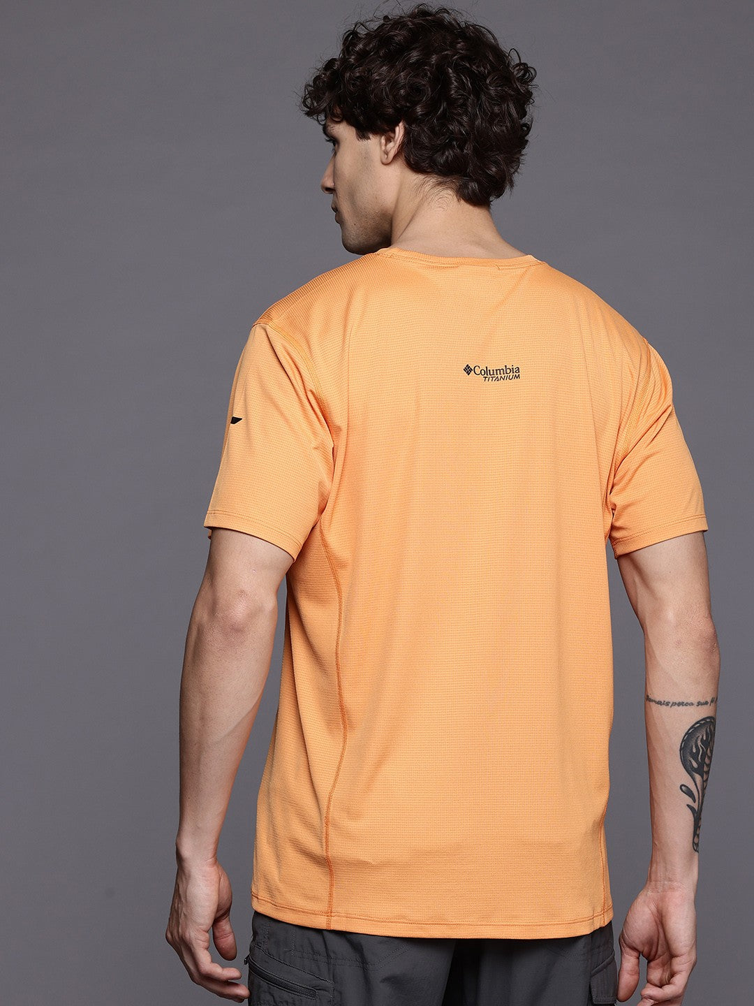 A Men Wearing Columbia Men Orange Cirque River Pro SS Crew (Sun Protection)