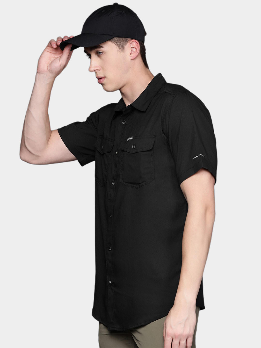A Men Wearing Columbia Men Black Utilizer II Solid Short Sleeve Shirt (Sun Protection)