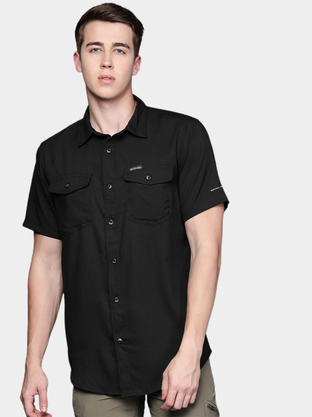 A Men Wearing Columbia Men Black Utilizer II Solid Short Sleeve Shirt (Sun Protection)