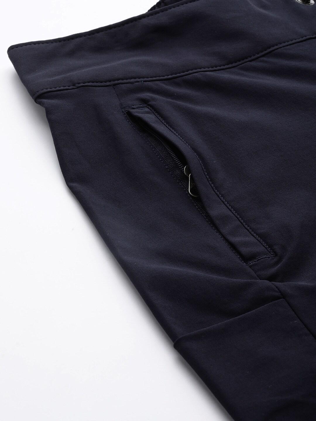 A Women Wearing Columbia Women Navy Blue Firwood Core Pant (Sun Protection)