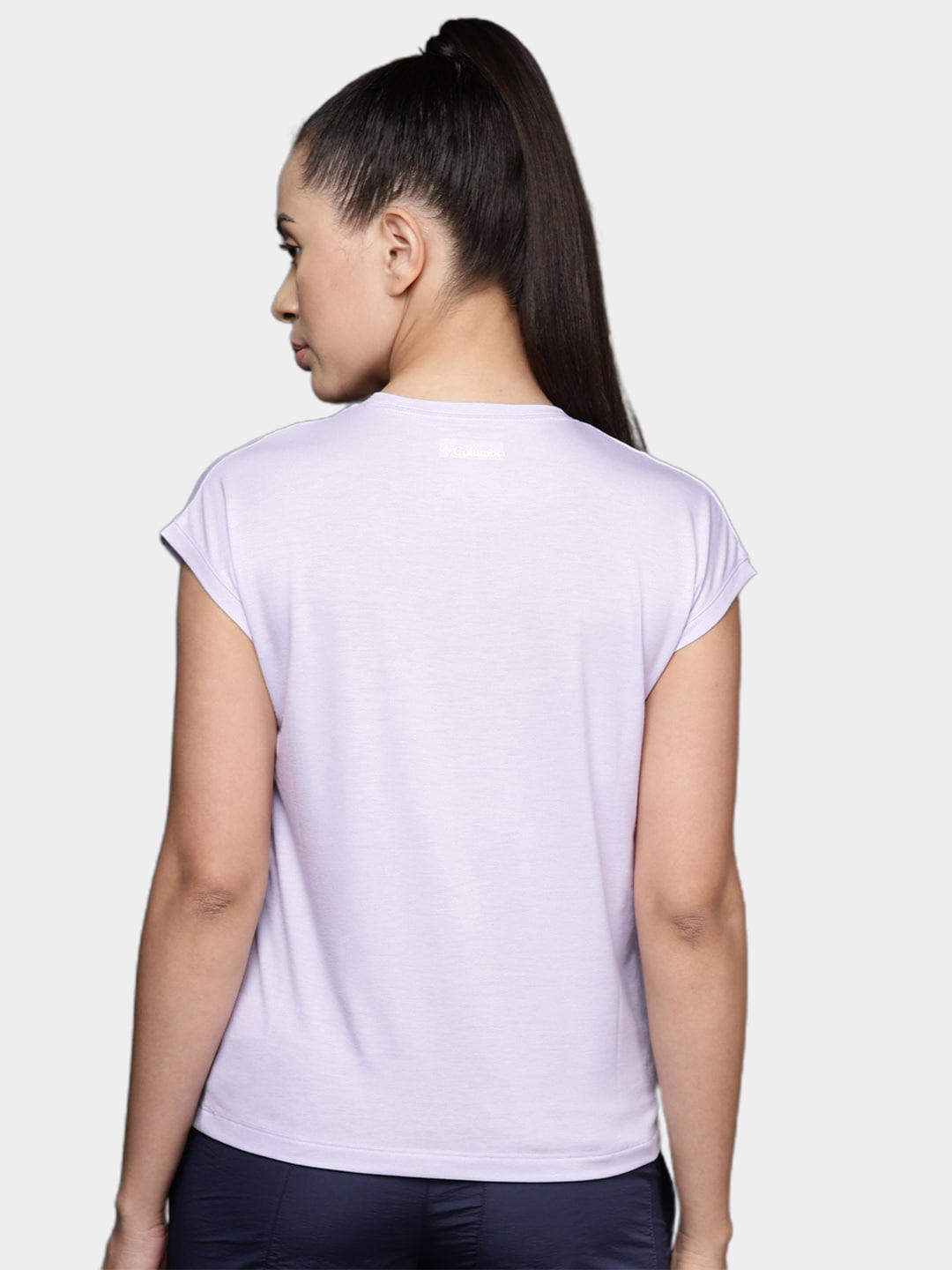 A Women Wearing Columbia Women Purple Boundless Trek Short Sleeve Tee