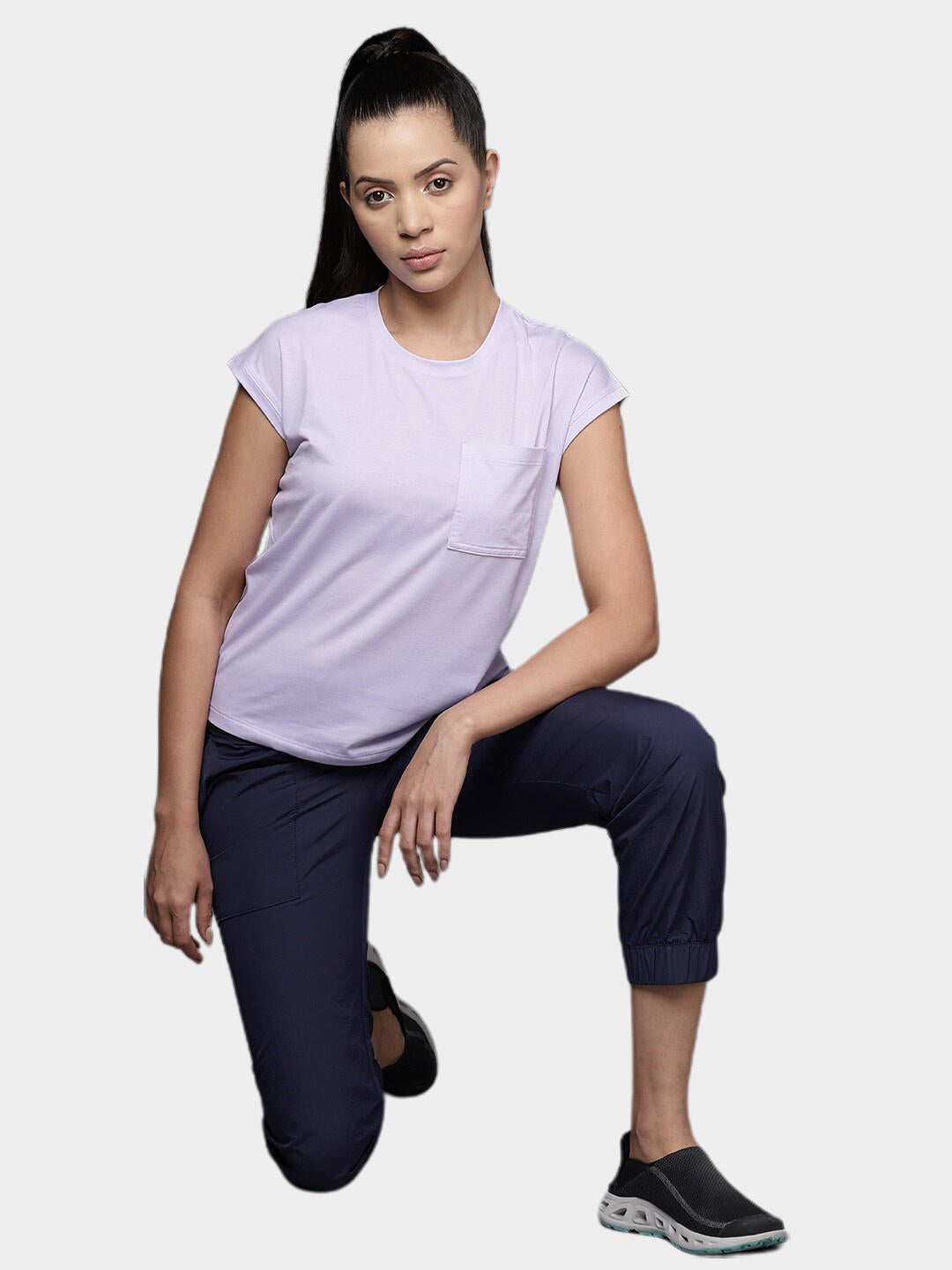 A Women Wearing Columbia Women Purple Boundless Trek Short Sleeve Tee