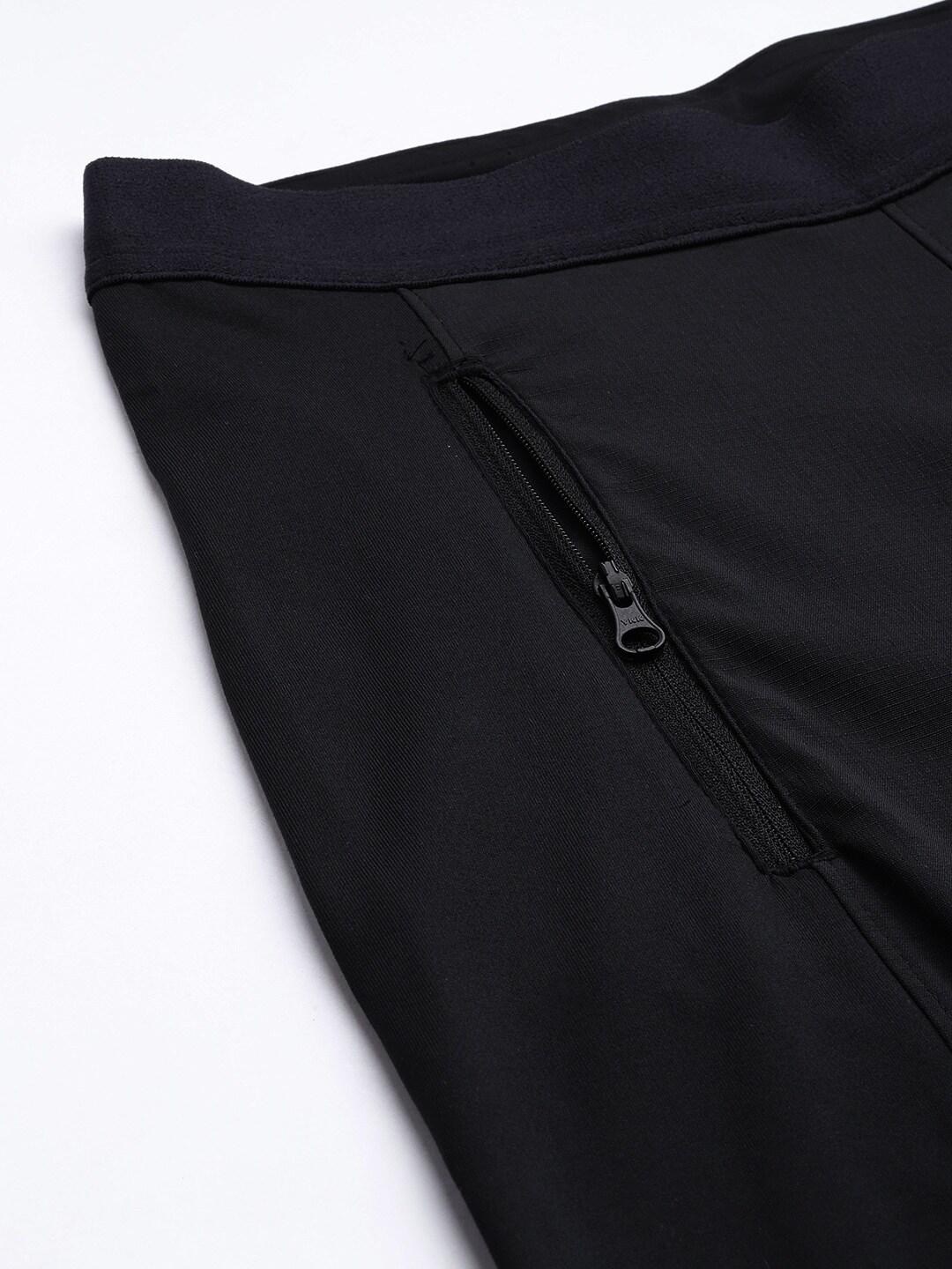 A Women Wearing Columbia Women Black On The Go Hybrid Pant (Sun Protection)