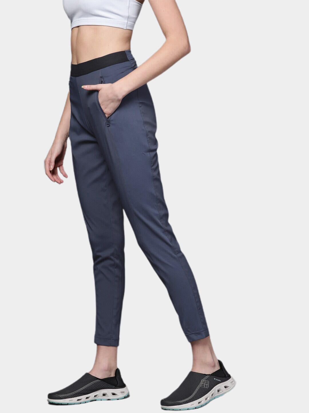 A Women Wearing Columbia Women Navy Blue On The Go Hybrid Pant (Sun Protection)